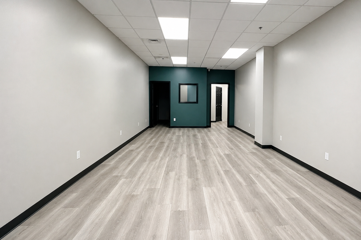 Commercial space after build-out with updated flooring and finishes