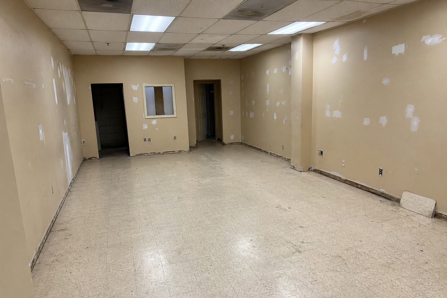 Commercial space before build-out with dated finishes